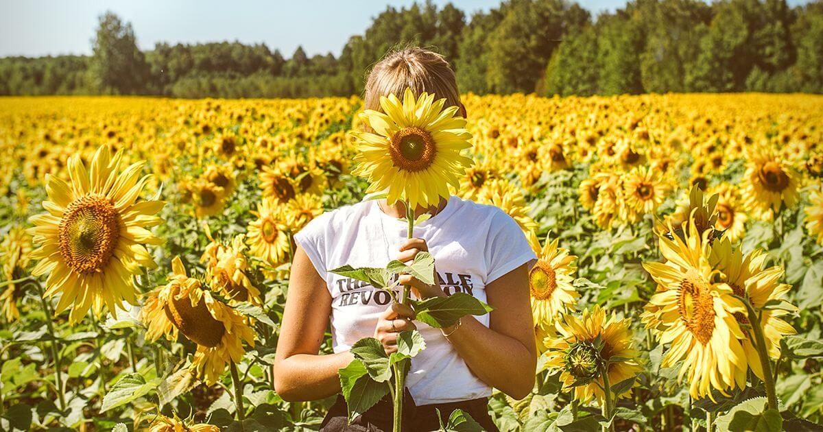 Vitamin D Immune Health woman in sunflower field